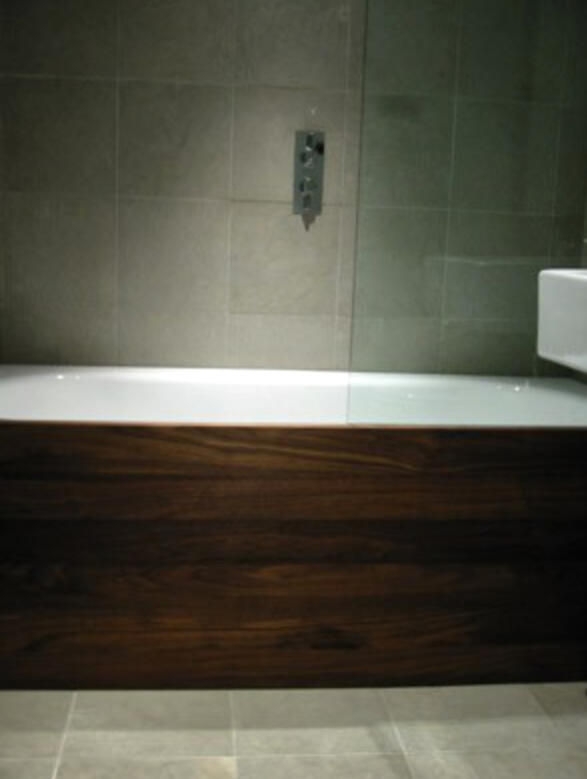 Bathroom in blue limestone and walnut